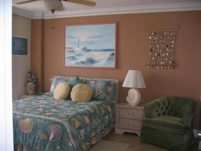 The Bedroom The spacious bedroom features a queen size bed and access to the large balcony.